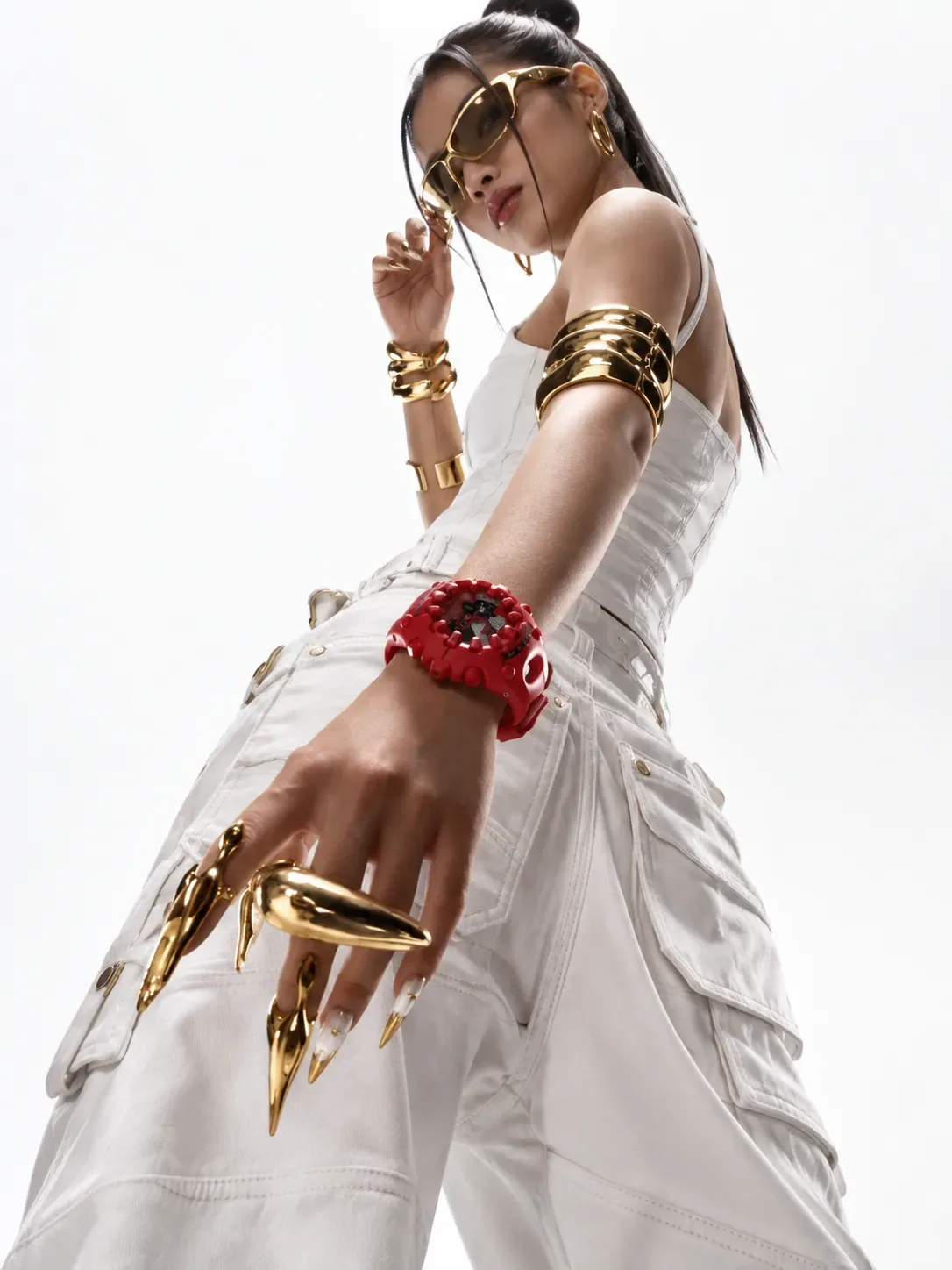 Portrait in white with gold cuffs against a white wall